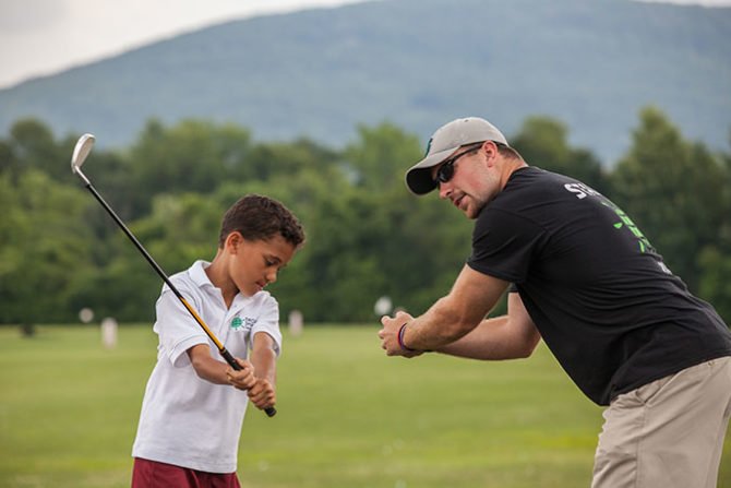 world sports camp golf boy instructor