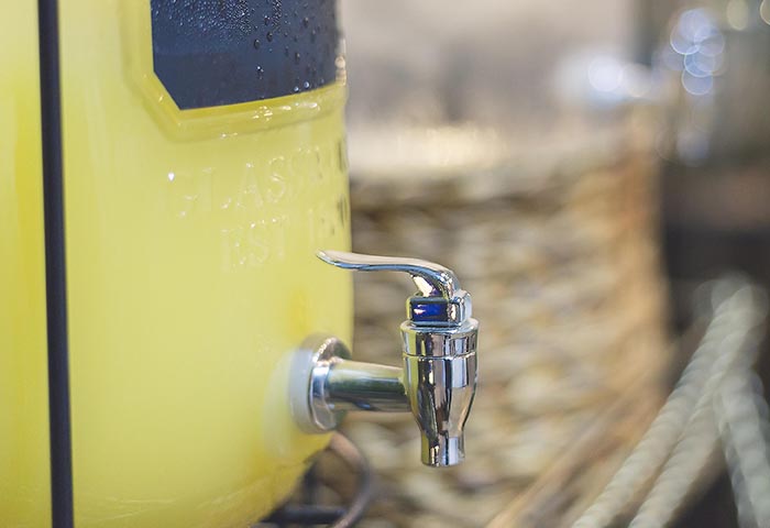 glass dispenser filled with margaritas fountainof30