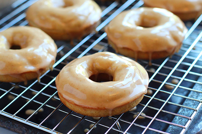 warm apple baked donuts on a rack