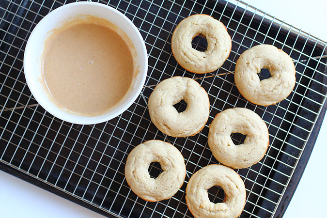 baked donuts with glaze in bowl on a rack foiuntinof30