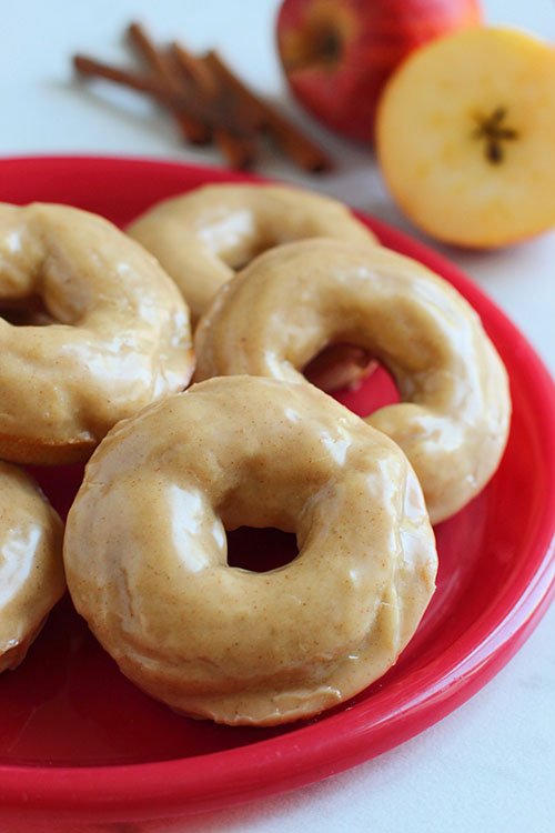 Apple Cinnamon Baked Donuts on a red plate fountainof30