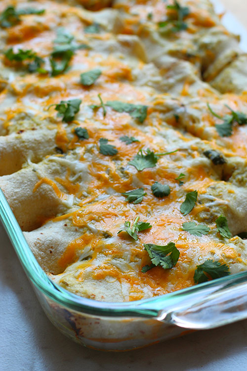 salsa verde chicken enchiladas in glass pan fountainof30