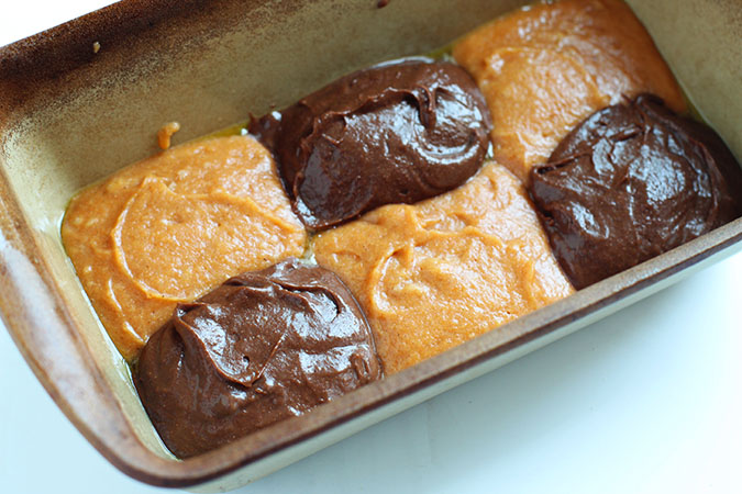 create two horizontal rows of batter, alternating between pumpkin and chocolate scoops.