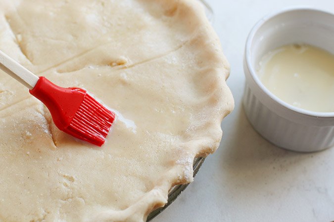 brushing butter on pie crust fountainof30