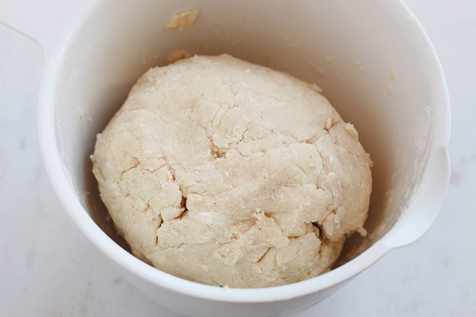 dough for crust in ball in white bowl fountainof30