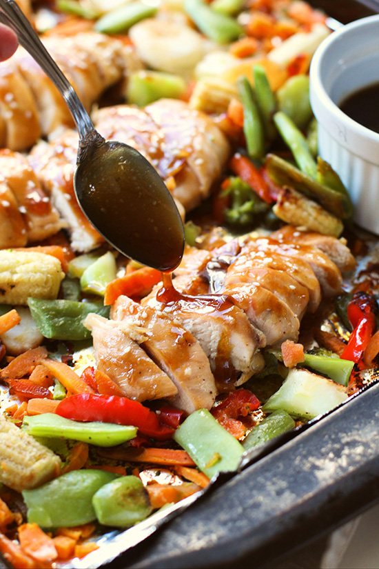 drizzling sauce on Sheet Pan Chicken Teriyaki fountainof30