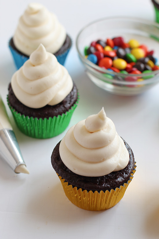 3 chocolate cupcakes with white frosting fountainof30