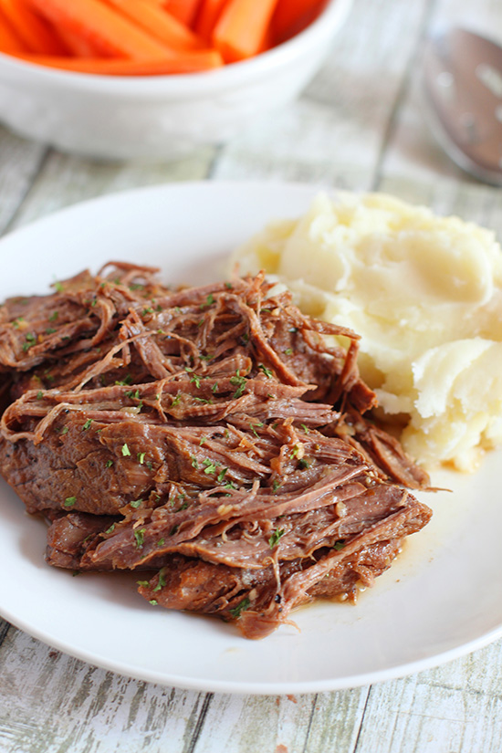 Slow Cooker Pot Roast serving with mashed potatoes and carrots fountainof30