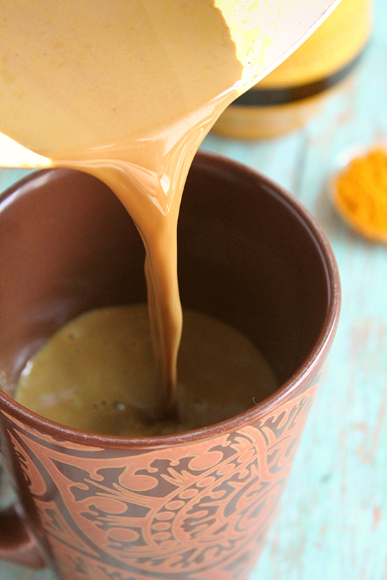 turmeric hot cocoa pouring into mug fountainof30