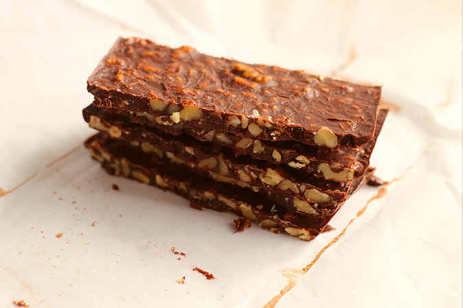 keto crunch bars sliced and stacked foiuntainof30