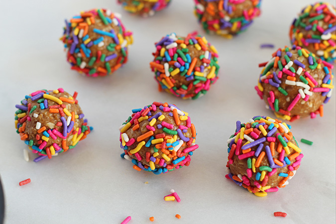 birthday cake protein balls on parchment fountainof30