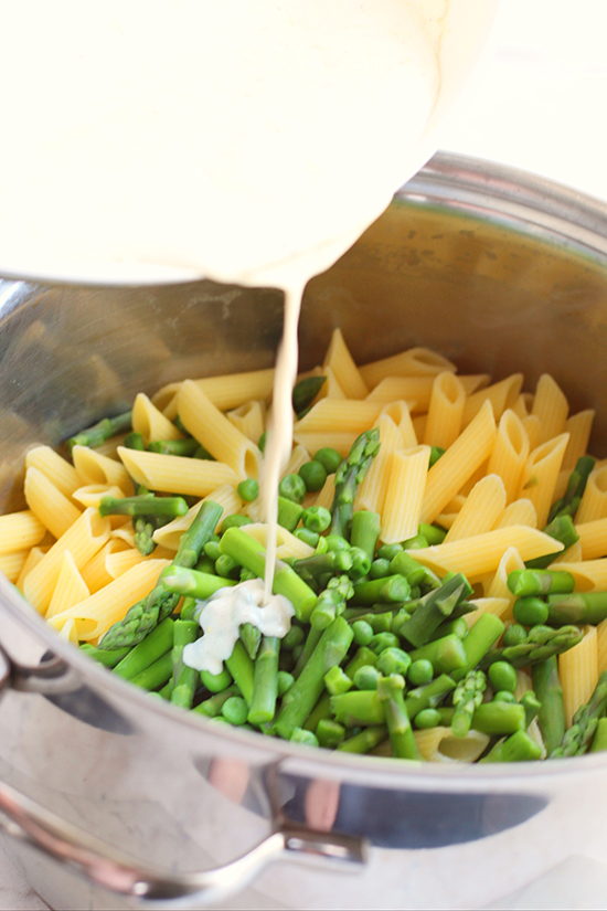 sause over pasta with asparagus fountainof30