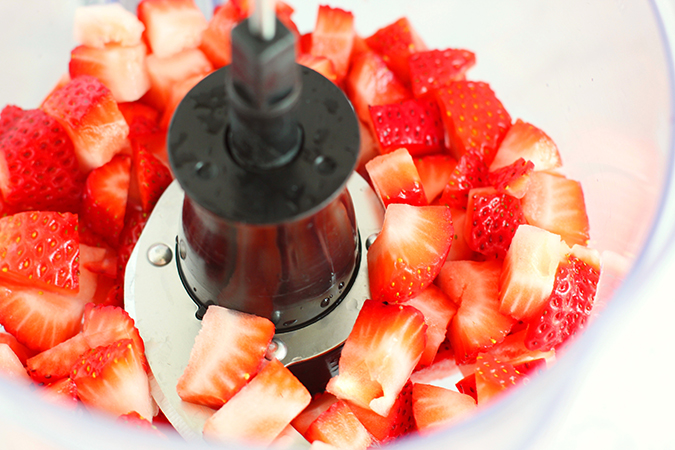 close up fresh strawberries in food processor fountainof30
