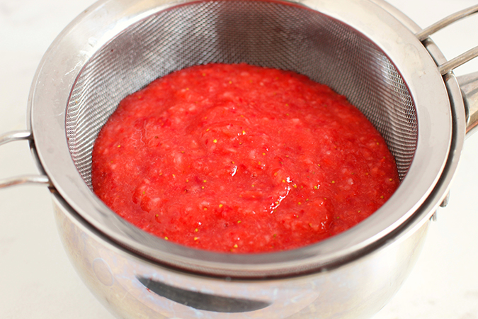 straining fresh strawberry puree fountainof30
