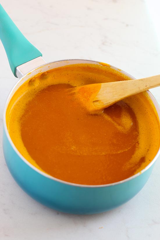 stirring Pumpkin Soup in bleue sauce pan fountainof30