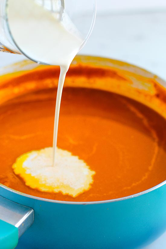 pour in heavy cream to pumpkin mixture fountainof30