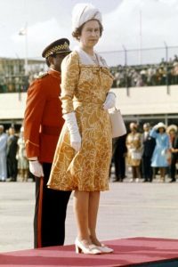 Queen Elizabeth in mustard and white dress in Jamaica