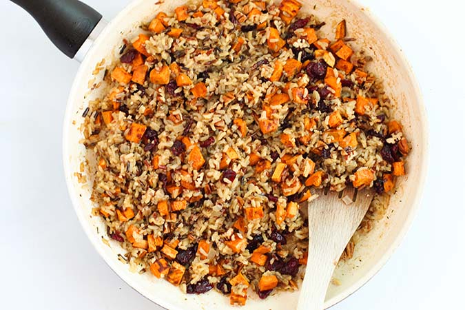 mixing cooked ingredents sweet potato cranberry wild rice fountainof30