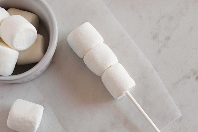 3 marshmallows on a lollipop stick fountainof30