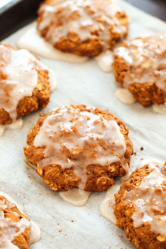 iced gingerbread oatmeal cookies on parchment fountainof30