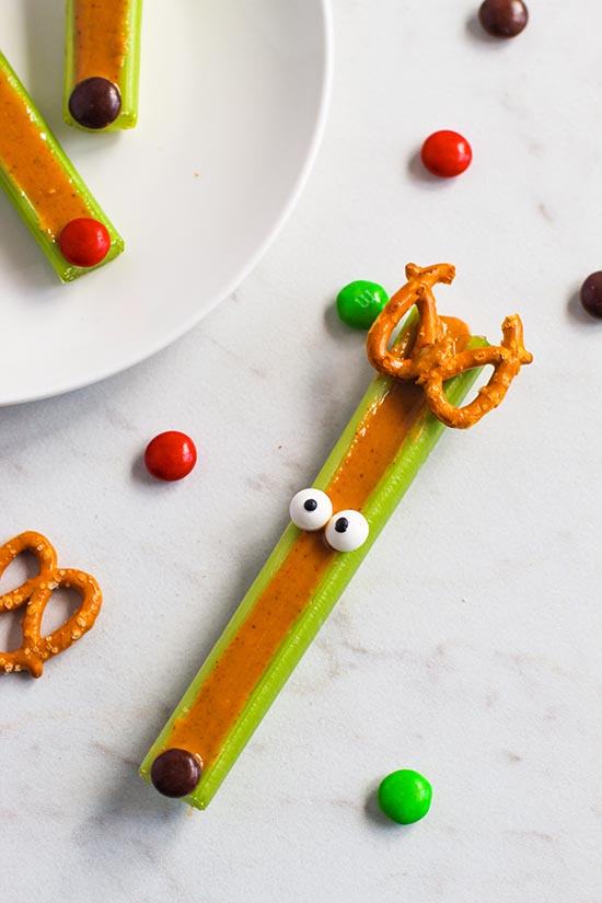 decorating reindeer celery sticks with peanut butter fountainof30
