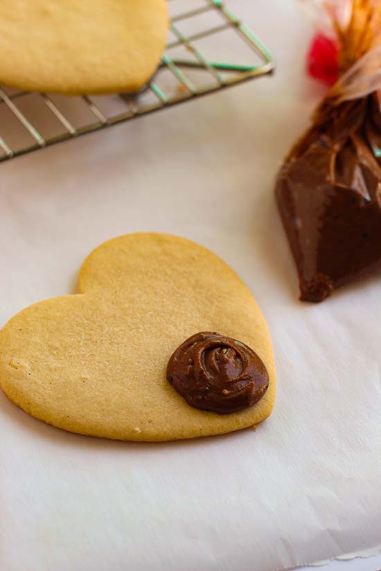 chocolate frosting dot on heart cookie fountainof30