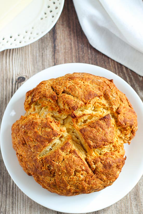 baked irish soda bread on white plate fountainof30