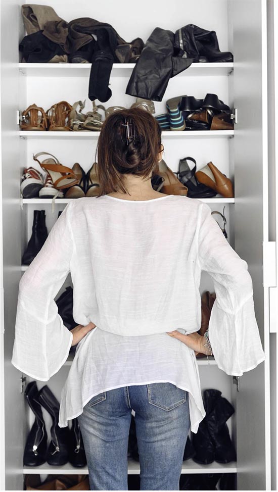 woman looking at her wardrobe