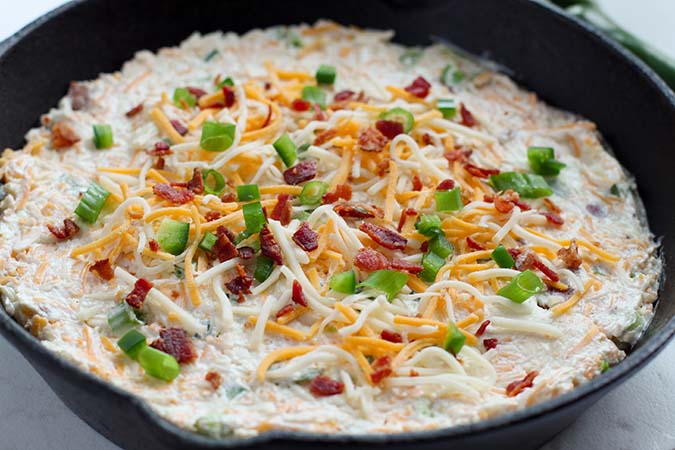 Jalapeno Popper Dip mixture in skillet before baking fountainof30