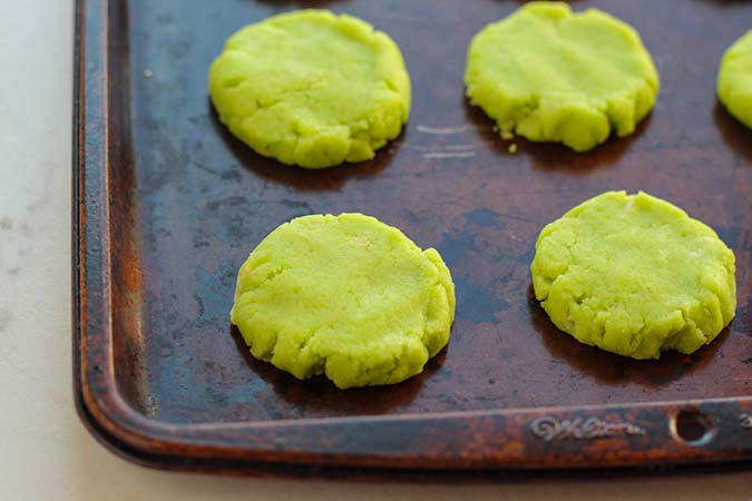 flatten lime cookie batter on cookie sheet fountainof30