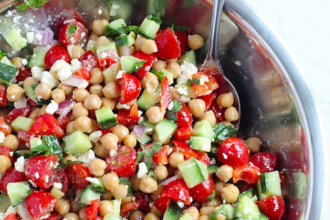 toss mediterranean chickpea salad with dressing fountainof30