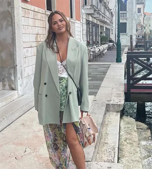 oversized jacket trend Chrissy Teigen light green with floral skirt fountainof30