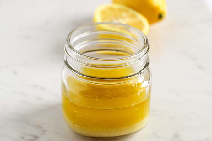 lemon vinaigrette dressing in a small mason jar fountainof30