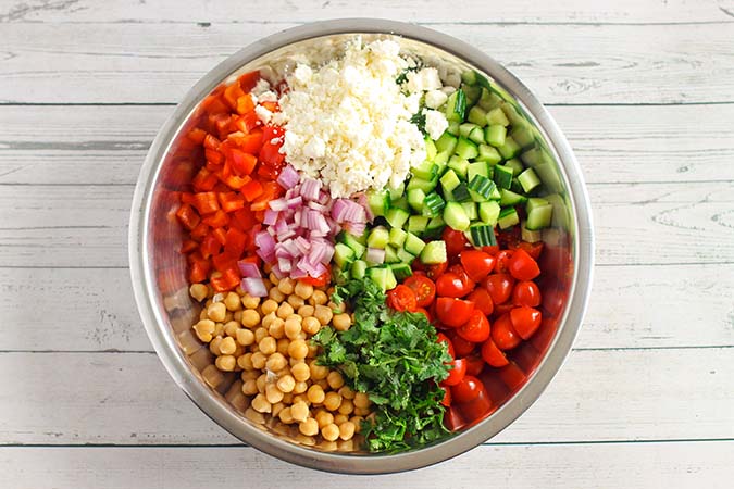 diced salad ingredients in a large mixing bowl fountainof30