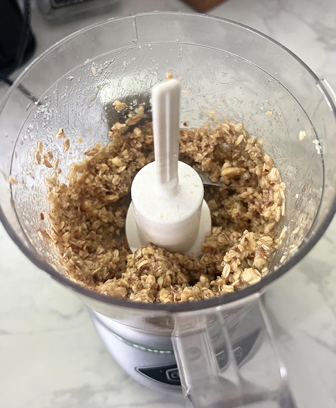nut topping mixture in a food processor Blueberry Oatmeal Muffins fountainof30