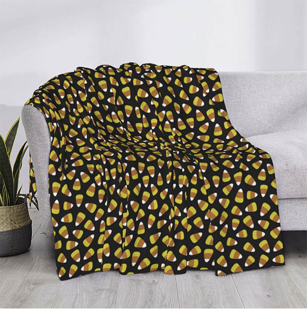 candy corn print throw on white sofa fountainof30
