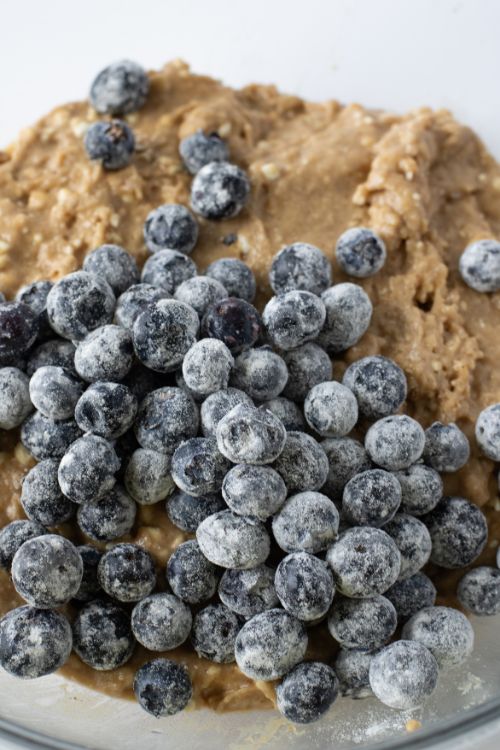 Blueberries with 1 Tbsp flour fold into batter.