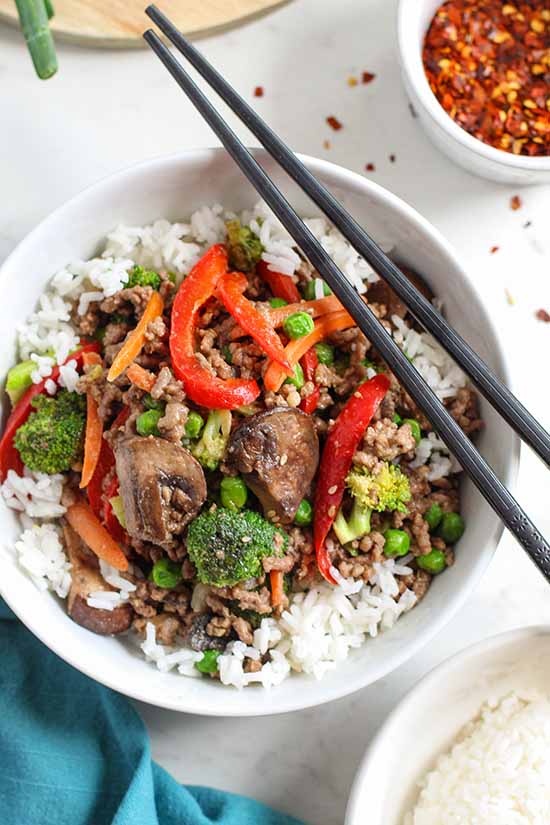 ground beef stir fry. with sesame seeds, chopped scallions, and extra chili flakes