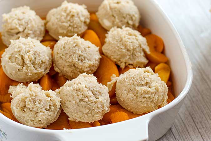 peach filling topped with cobbler batter