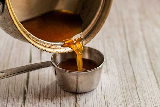 Simmer the apple cider in a small saucepan - reduce to 1/3 cup.