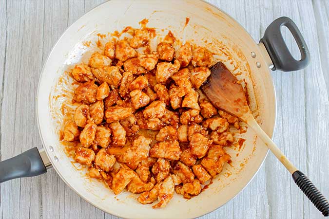 Cooked chicken to the skillet with sauce fountainof30