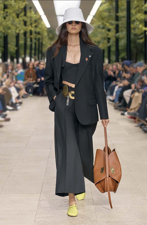 Celine Spring 2026 runway featuring bright yellow soft flat sneakers worn with wide leg trousers