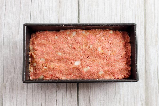 Shape the mixture evenly into a loaf pan.
