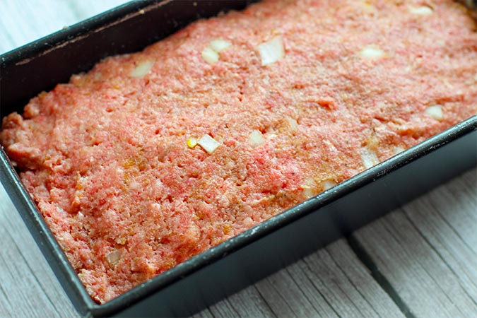 classic meatloaf raw in pan