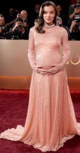 Hailee Steinfeld in Prada gown golden gloibes