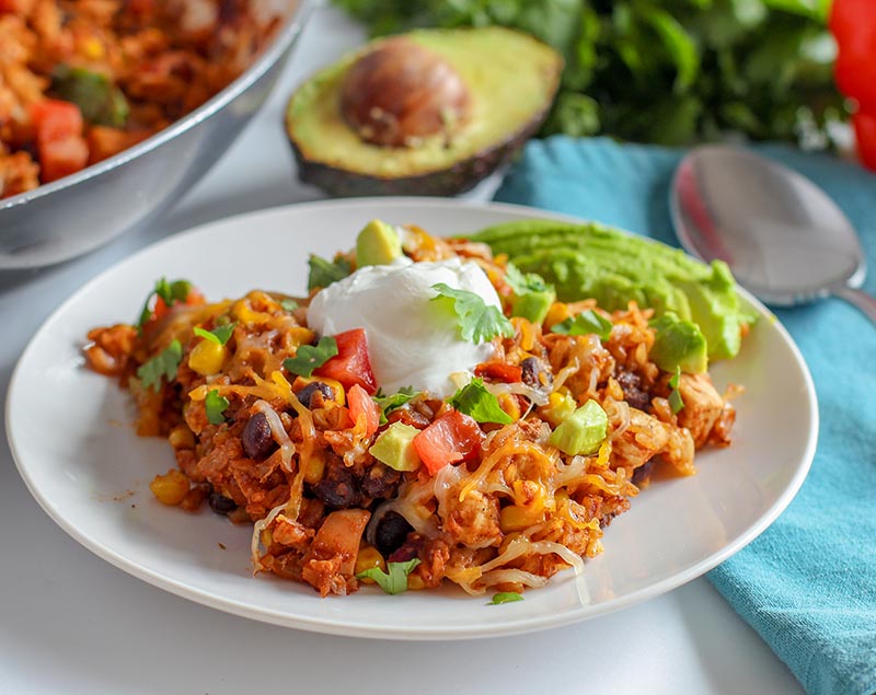 Serve skillet chicken with sour cream and sliced avocado