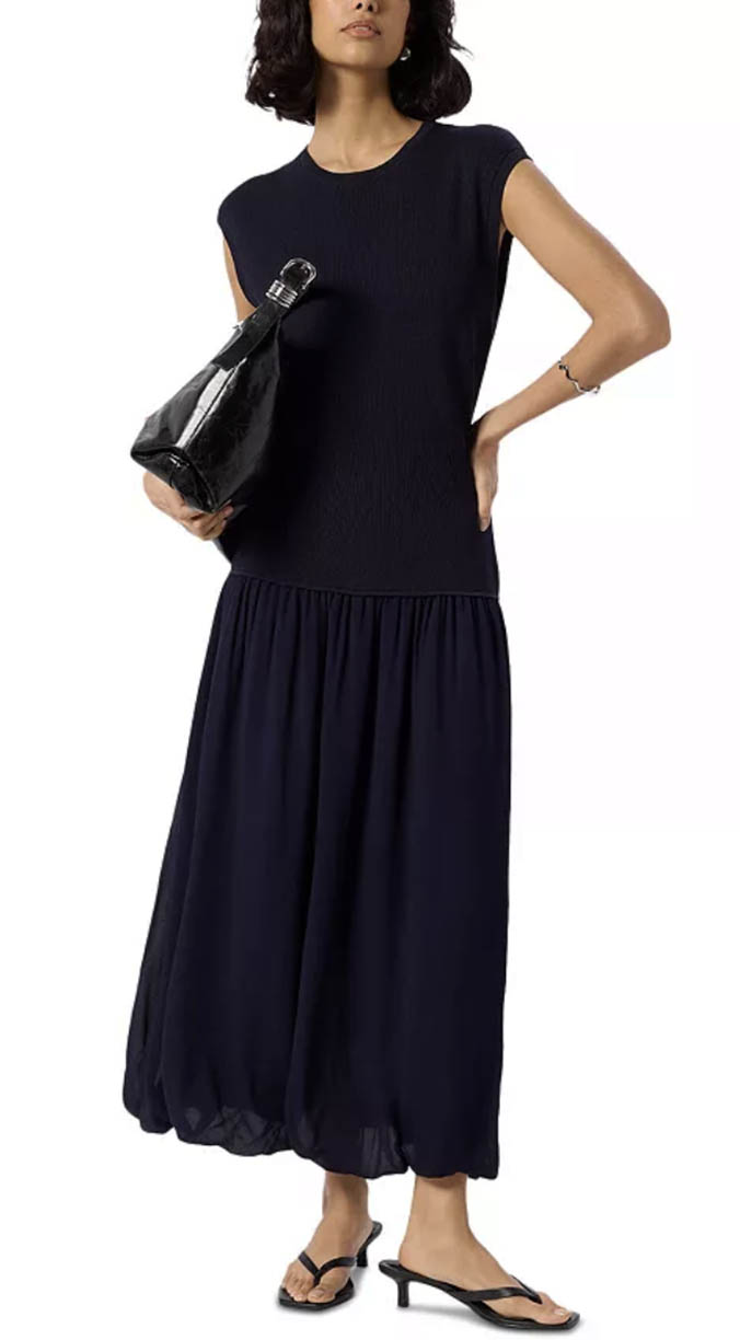 wo,man wearing fitted cap sleeve bubble hem maxi dress fountainof30
