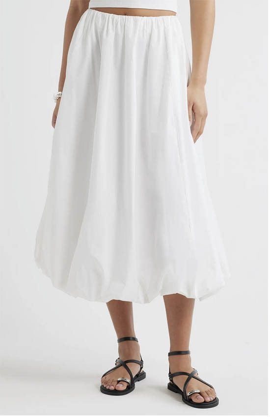 Woman wearing white bubble hem midi skirt for summer 2026 fountainof30