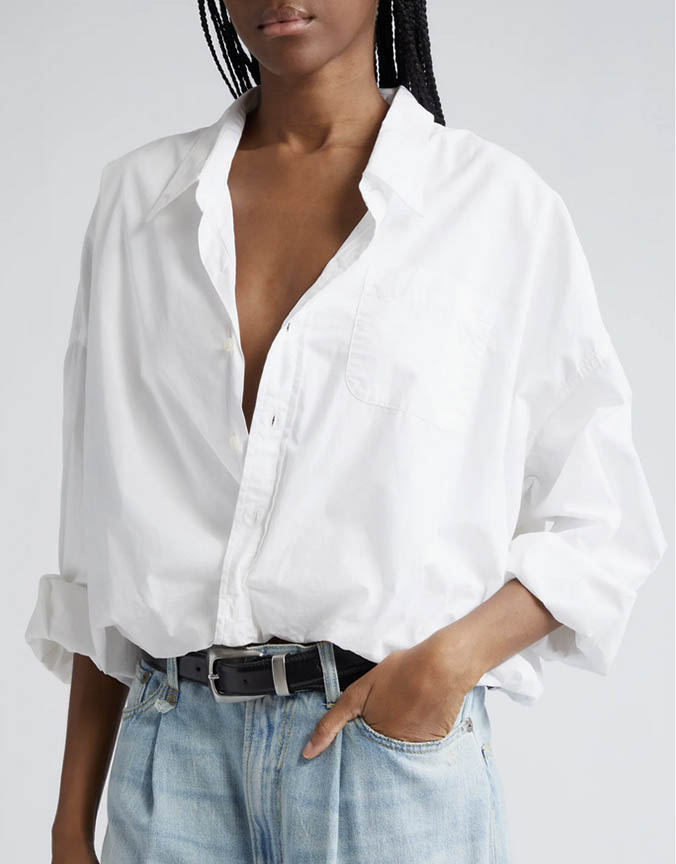 woman wearing white bubble hem shirt fountainof30