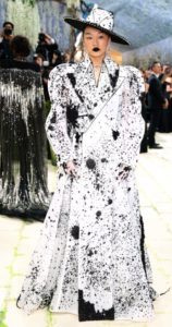 Audrey Nun wearing Robert Wun black white spotted ;lomng coatdress 